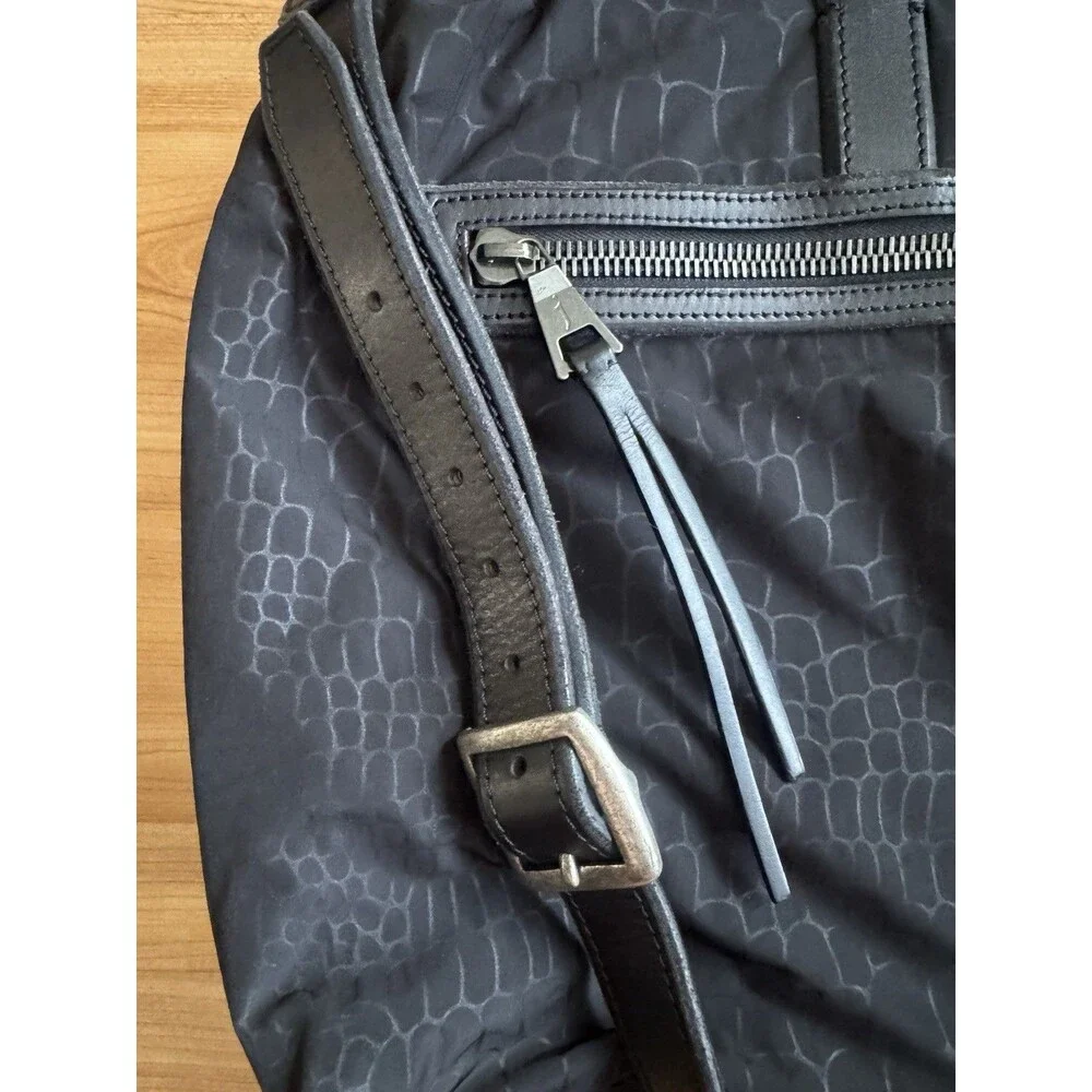 John Varvatos around multiple metal